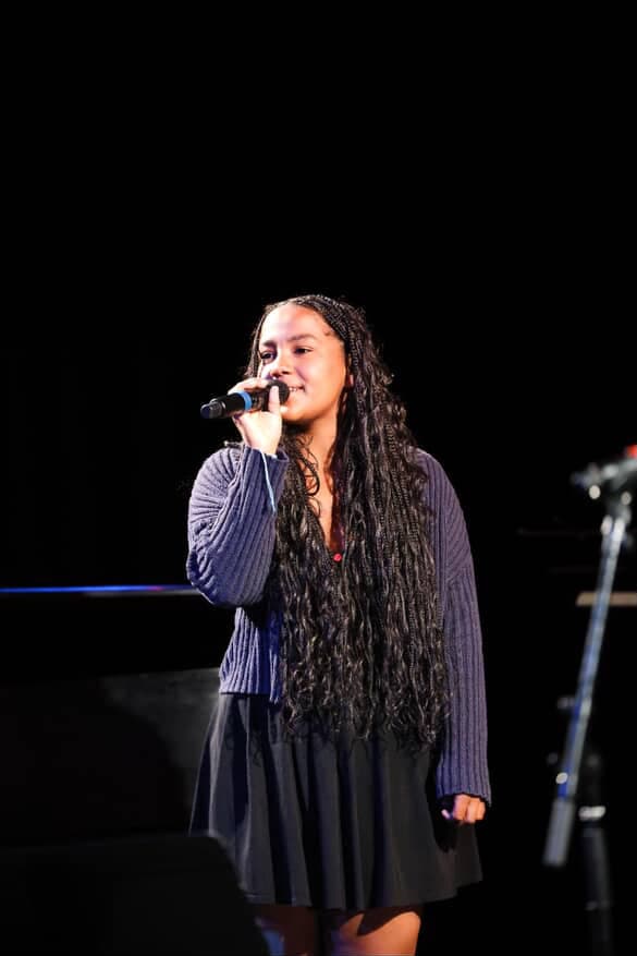 Isy Aboagye performing on stage